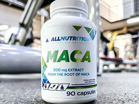 Bottle of AllNutrition Maca supplement in a gym setting