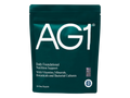 A dark green stand-up pouch of AG1 Daily Foundational Nutrition Support with white text and logo, shown on a plain white background.
