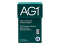 A box of AG1 Daily Foundational Nutrition Support supplement, featuring a dark teal-green color with white text and logo, on a plain white background.