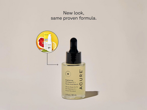 Acure skincare serum bottle with dropper on a beige background, featuring text 'New look, same proven formula.'