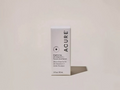 Acure serum packaging on a light beige background