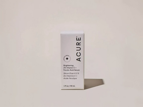 Acure serum packaging on a light beige background