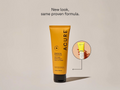 Acure skincare tube with a beige background and text 'New look, same proven formula.'