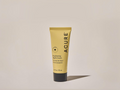 Acure skincare tube on a beige background