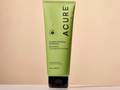 Acure Curiously Clarifying Conditioner tube on a beige background