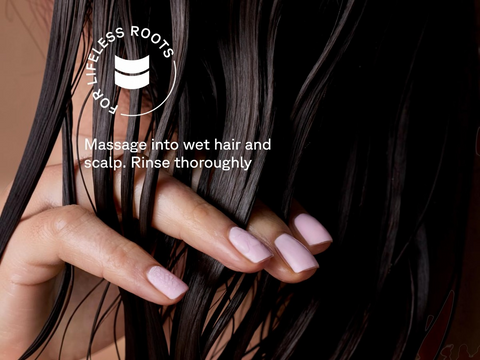 Close-up of hands with pink nail polish holding dark hair, with a brand logo and text overlay.