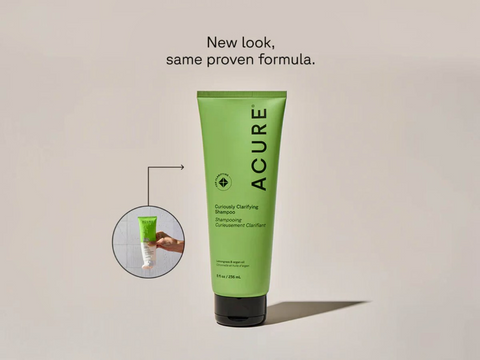 Acure shampoo bottle with a smaller inset image of a hand holding a bottle, on a beige background.