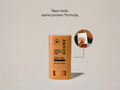 Acure Invisible Sunscreen Stick SPF 50 on a beige background with text 'New look, same proven formula.'