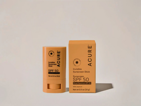 Acure Invisible Sunscreen Stick SPF 50 on a light gray background