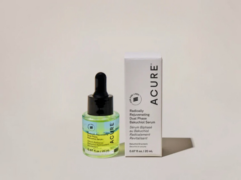 Acure serum bottle and box on a light gray background