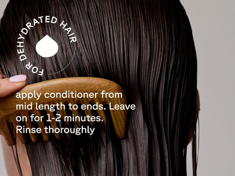 Person using a wooden comb on wet hair with text about conditioning hair.