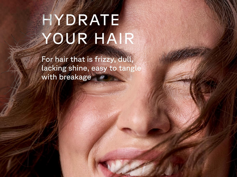 Woman with frizzy hair and text overlay 'HYDRATE YOUR HAIR' on a blurred background