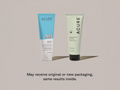 Two Acure hair care products on a beige background