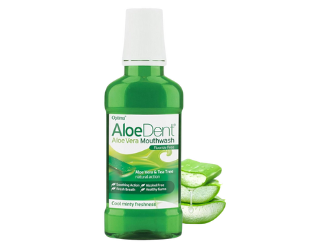 Green bottle of AloeDent Aloe Vera Mouthwash with aloe vera slices on a white background