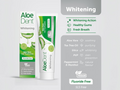 Aloe Dent Whitening toothpaste packaging with product details on a gray background