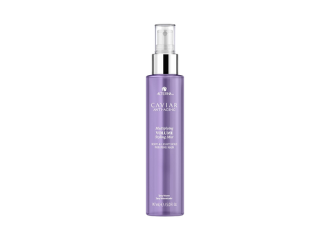 Purple spray bottle with silver nozzle on a white background