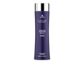Purple shampoo bottle with silver cap on a white background