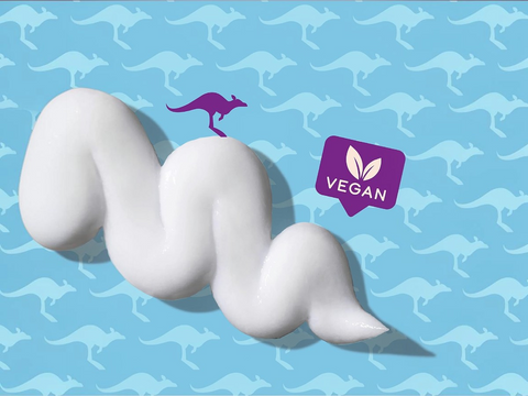 White cream-like substance with a purple kangaroo and 'Vegan' logo on a blue background with kangaroo pattern