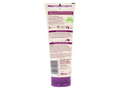 Back view of a tube of shampoo with text and branding on a white background