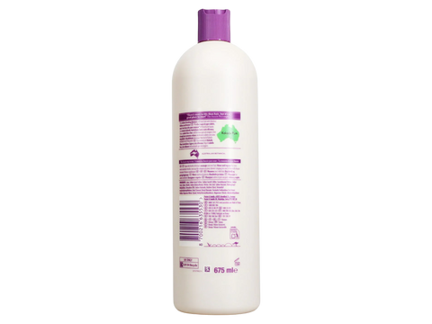 White bottle with purple cap on a white background