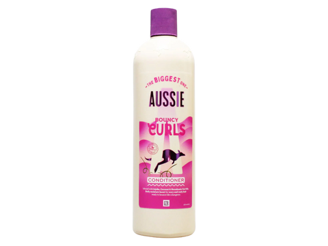 Aussie Bouncy Curls conditioner bottle on a white background