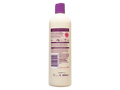 Bottle of shampoo with a purple cap on a white background