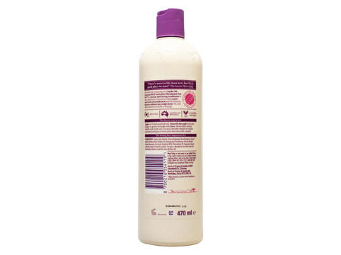 Bottle of shampoo with a purple cap on a white background