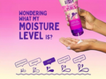 Aussie product being applied to hands with text about moisture levels on a pink background