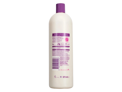 White bottle with purple cap on a white background