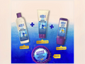 Aussie shampoo, conditioner, and treatment bottles on a blue and beige gradient background