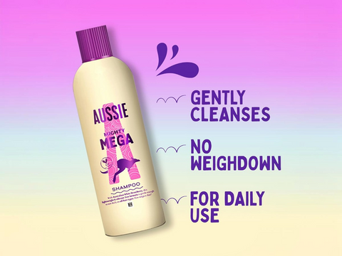 Aussie Mighty Mega shampoo bottle on a gradient purple and yellow background with text about its benefits.