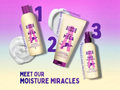 Aussie hair care products including shampoo, conditioner, and hair spray on a gradient background with text 'Meet our moisture miracles'.