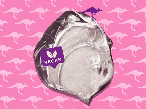 Clear plastic packaging with a 'Vegan' label on a pink background with kangaroo patterns