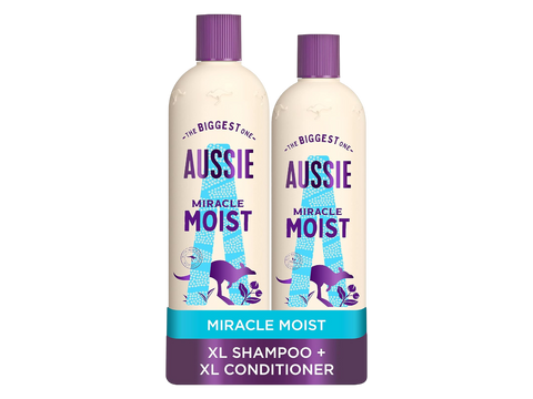 Two bottles of Aussie Miracle Moist shampoo and conditioner on a white background