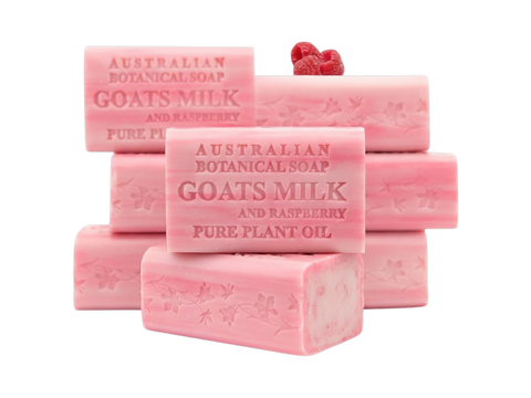 Pink bars of Australian Botanical Soap with Goats Milk and Raspberry on a white background