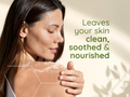 Woman with smooth skin holding her arm, with text 'Leaves your skin clean, soothed & nourished' on a beige background.