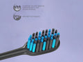 BIOMED Black Charcoal Toothbrush, medium bristles, on a clean background.