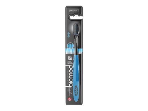BIOMED toothbrush package showing eco-friendly claim and bristle detail.