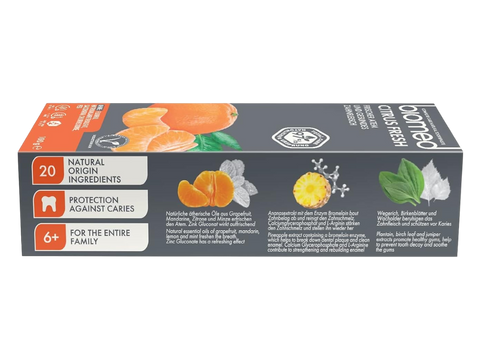 Greey & orange tube of BIOMED Citrus Fresh Natural Toothpaste on a clean background.