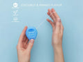 Close-up of BIOMED Coconut and Mango flavoredfloss stretched between fingers.