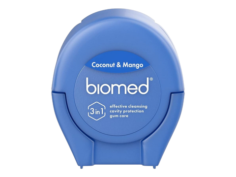 BIOMED Coconut and Mango flavored dental floss dispenser on a clean background.