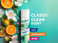 Batiste dry shampoo can with oranges and flowers on a teal background