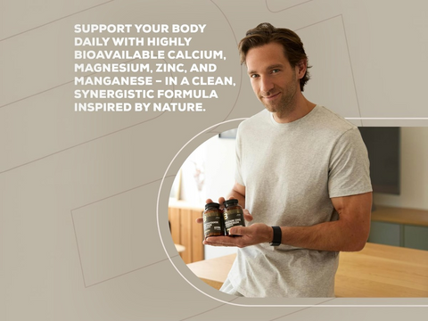 Man holding supplements with a neutral background and text about mineral support.