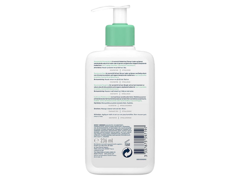 White bottle with green pump top on a white background