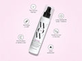 Hair product bottle with features listed on a pink background