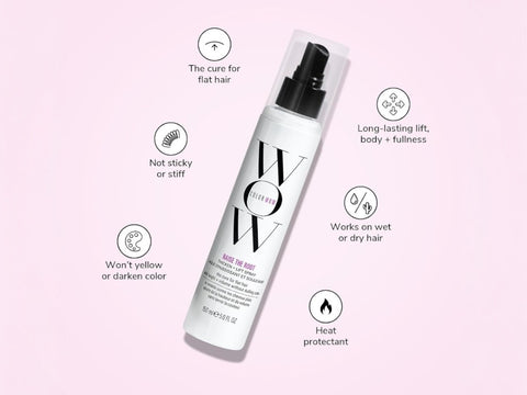 Hair product bottle with features listed on a pink background