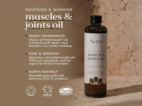 Fushi Really Good Muscle and Joints Oil 100 ml bottle on brown background with label close up