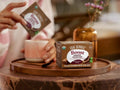How to Use: Four Sigmatic Cacao Mix packet being stirred into a mug of hot water.