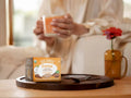 How to Use: Four Sigmatic Coffee Latte packet being mixed in a mug.