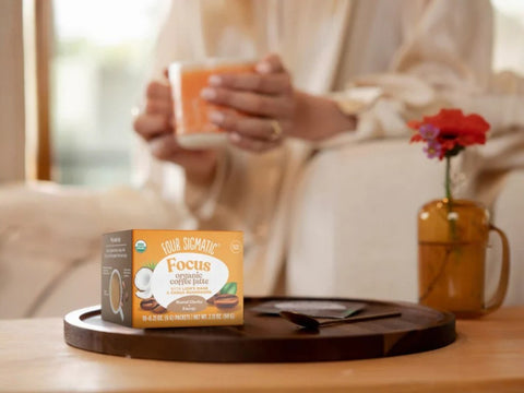 How to Use: Four Sigmatic Coffee Latte packet being mixed in a mug.